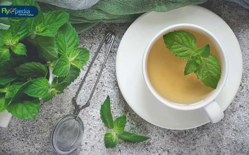 Sip the warm fragrant tea with fresh tea leaves